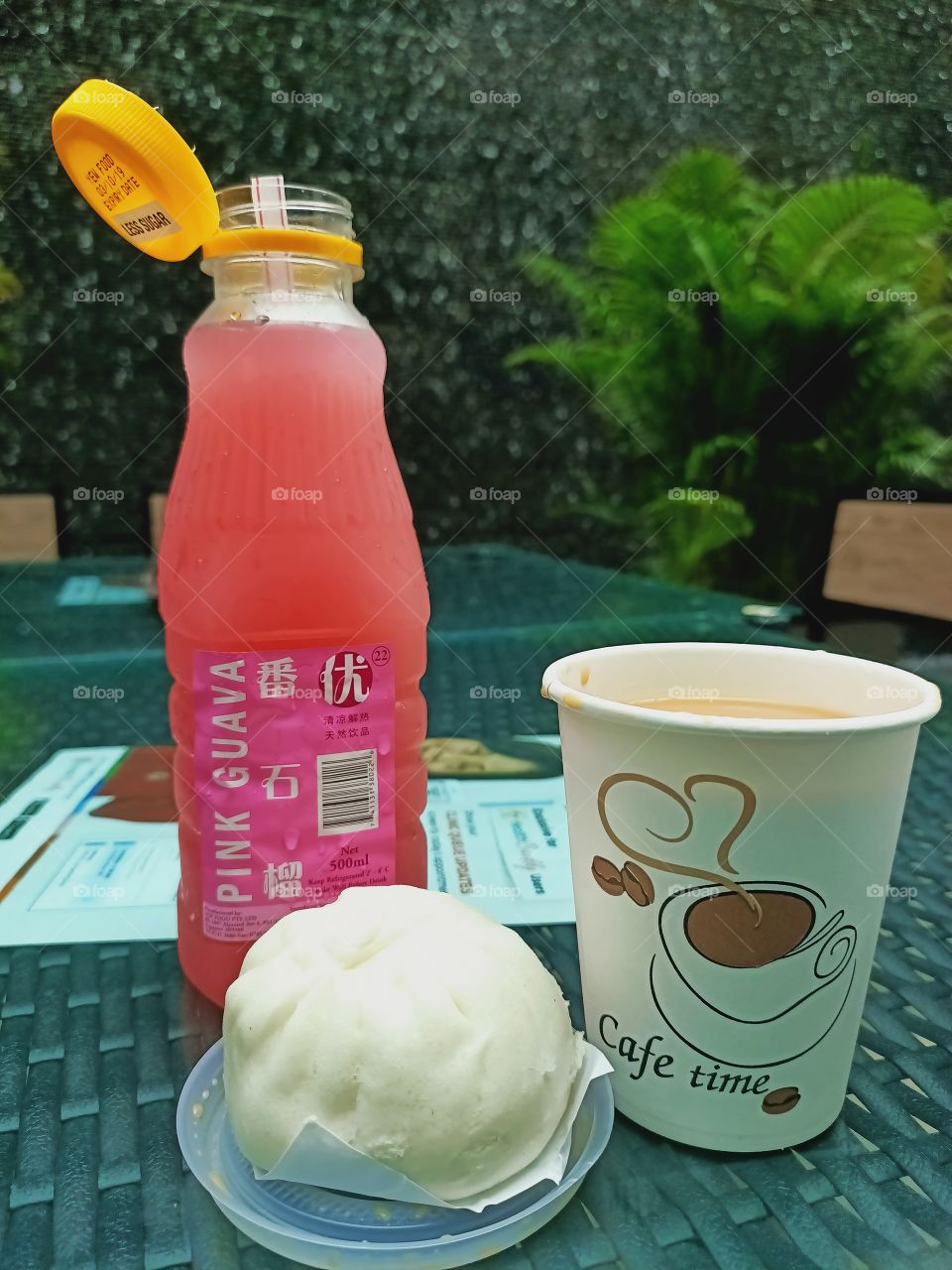 Secret leisure time having coffee or tea,  a juice and a bun.