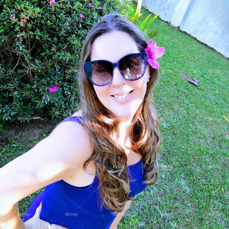 woman with flower on the ear