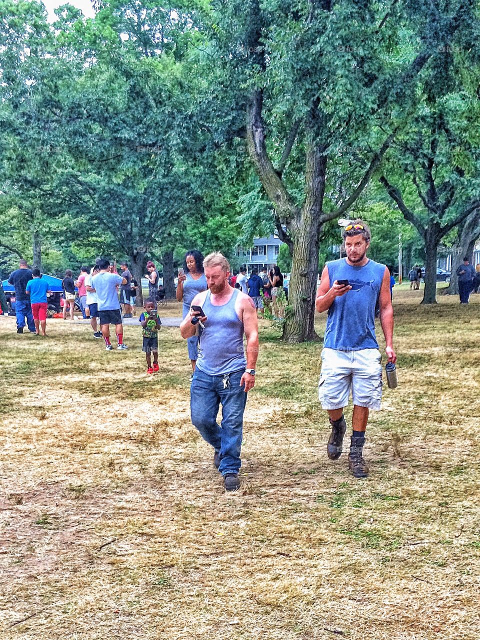 People using cellphone in park