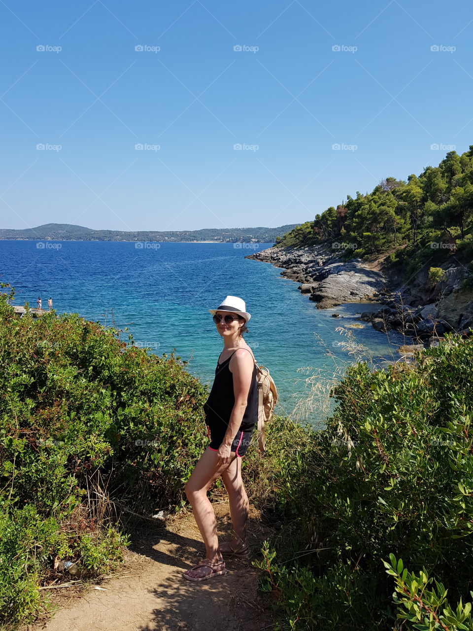 One young woman in vacation near the sea.