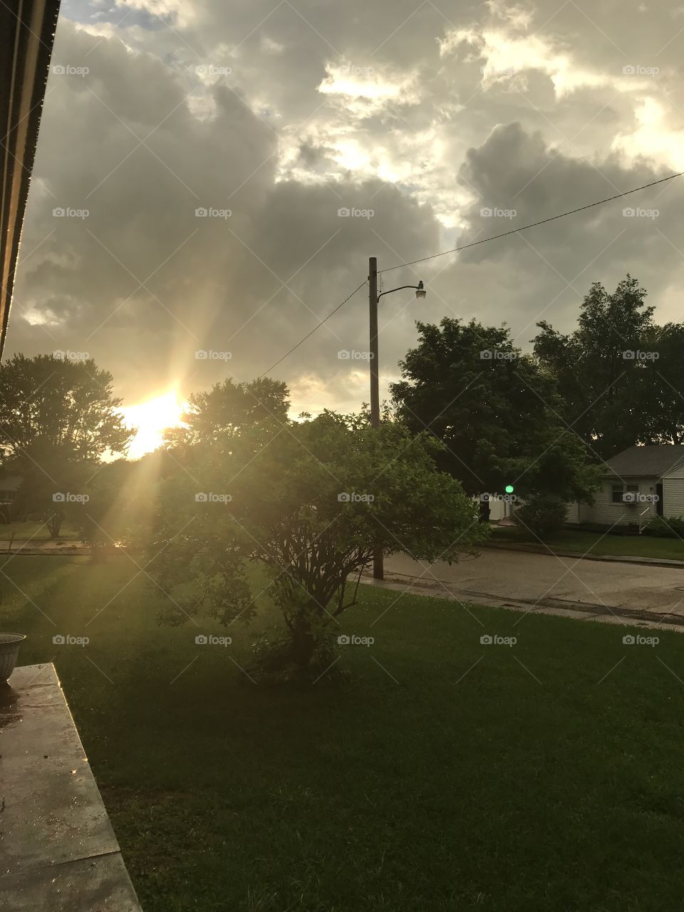 Front porch view looking to the West during a summer sunset 