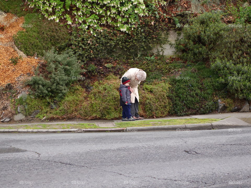 elderly woman talking to a child