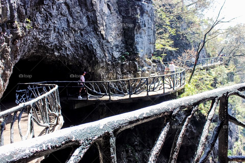 Walkway built high up in the mountains, on the cliffs, through the sky caves, in Zhangjiajie National Park in Hunan China.