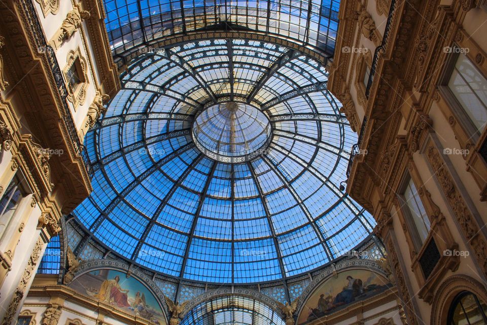 Neo-Renaissance style fasade and roof details of Galeria Vittorio Emanule in Milan.  Italy