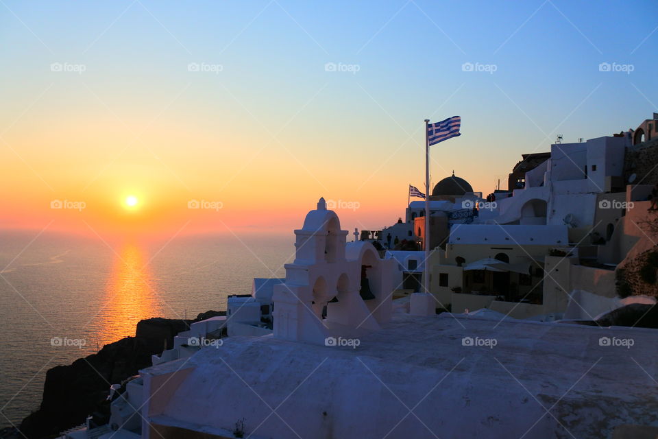 Greek flag and sun set