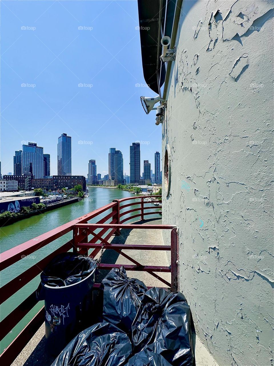 This is the watchtower of the “Pulaski Bridge” at “Newtown Creek” that connects “Greenpoint”, Brooklyn to LIC, Queens. Across the “East River” we see “Greenpoint” on the left, LIC and “Manhattan” on the right. 2024. Hypnotic Productions