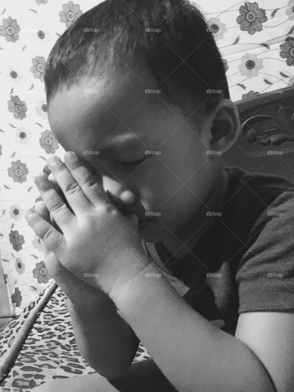 A little boy praying