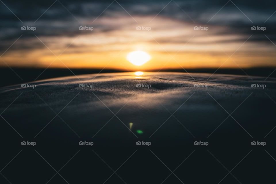  Leather waves cast themself before the sun.