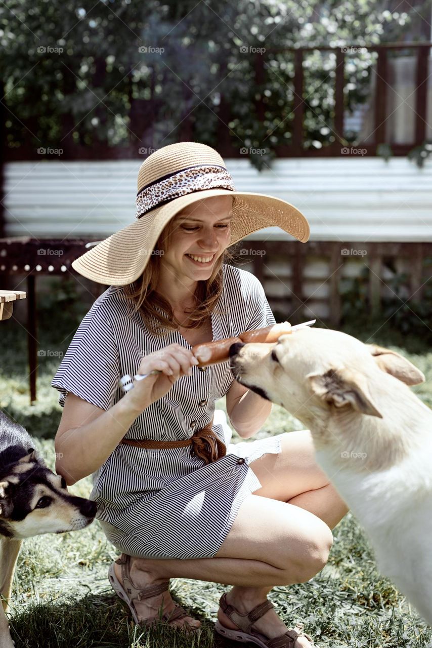 woman BBQ with dog