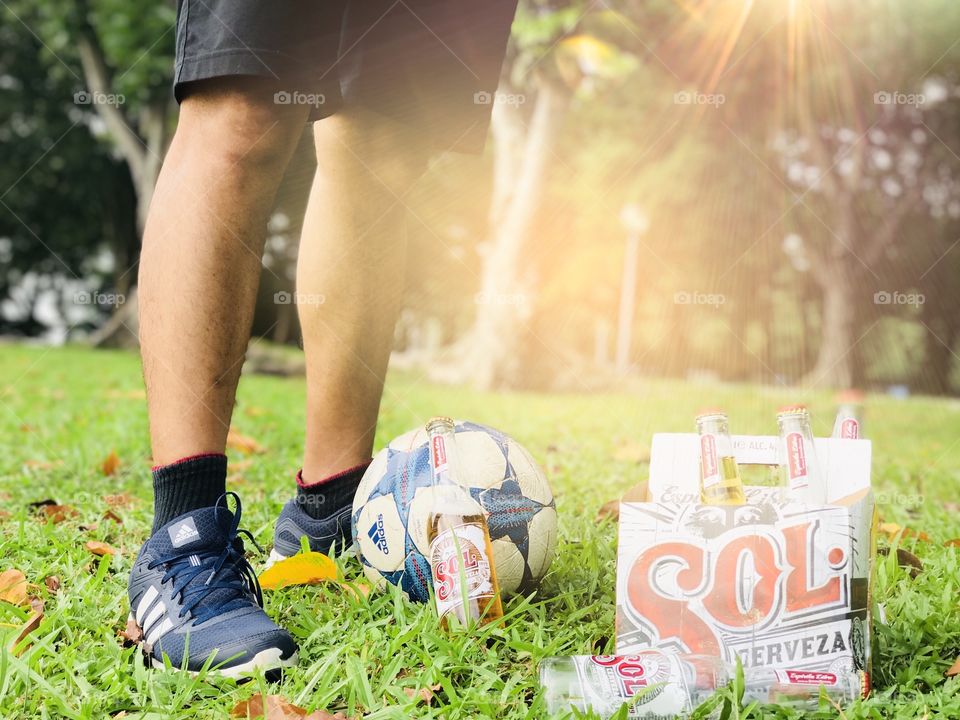 Sol beer while playing foot ball