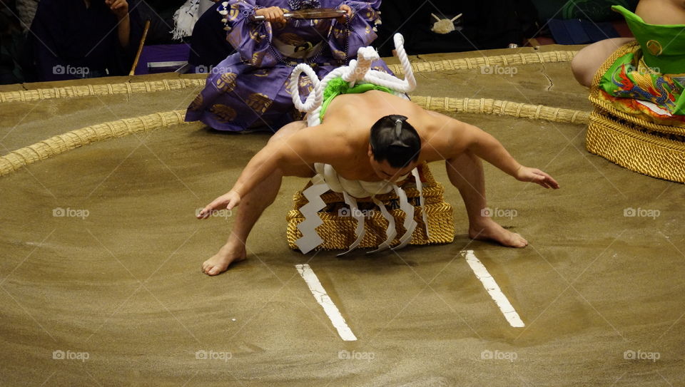 Yokozuna performing the opening ceremony for the days matches at the sumo tournament in Tokyo, Japan