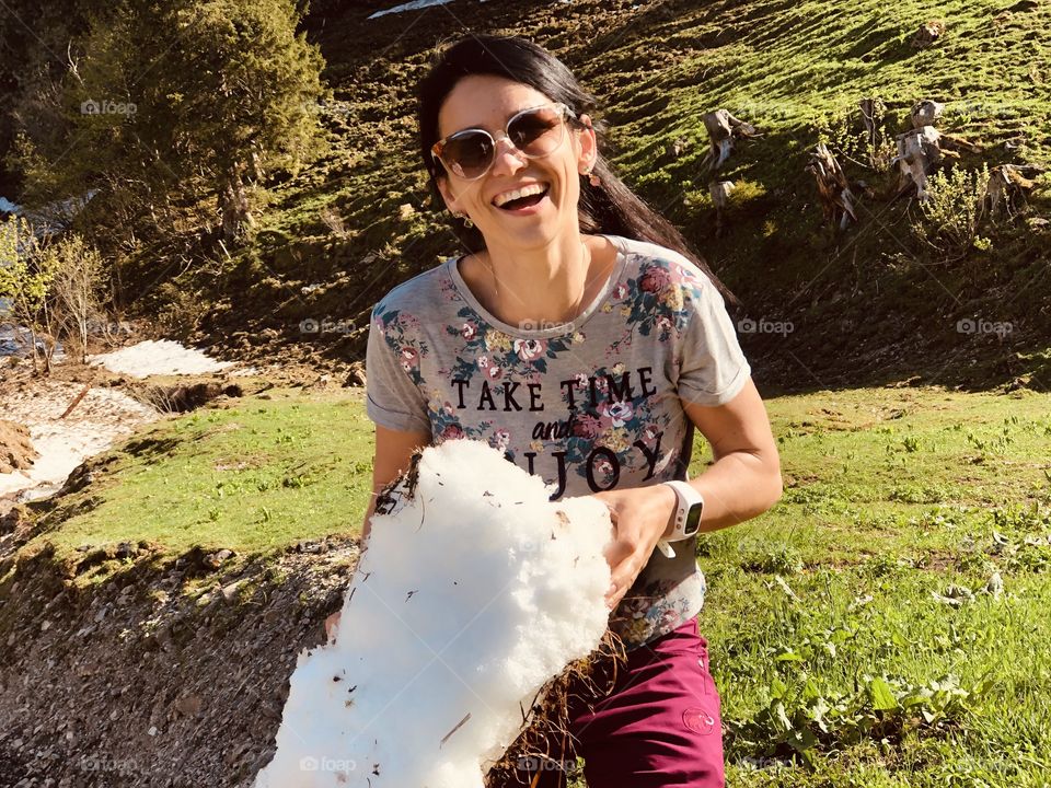 water flows, stream, waterfall, snow in the mountains , water flows, stream, waterfall, snow in the mountains, laughter, snow in hands, snow in holes, green grass, spring