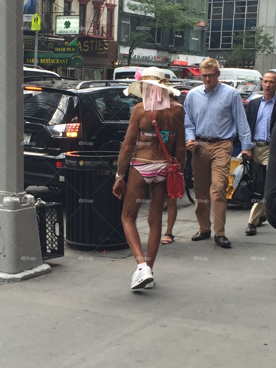 ONLY IN NY. man hanging out on the corner
