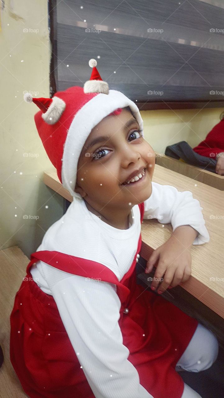 potrate of a cute smiling girl who is premature giving smile in front of camera