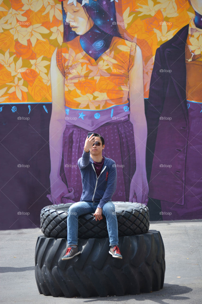 I captured a tourist talking a selfie in Wynwood Miami Fl of her culture. 