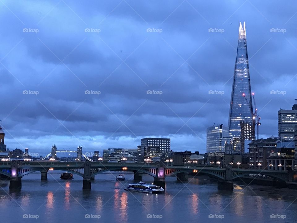 An amazing photo of London at dusk. Capturing the shard and fantastic reflections on the water.
