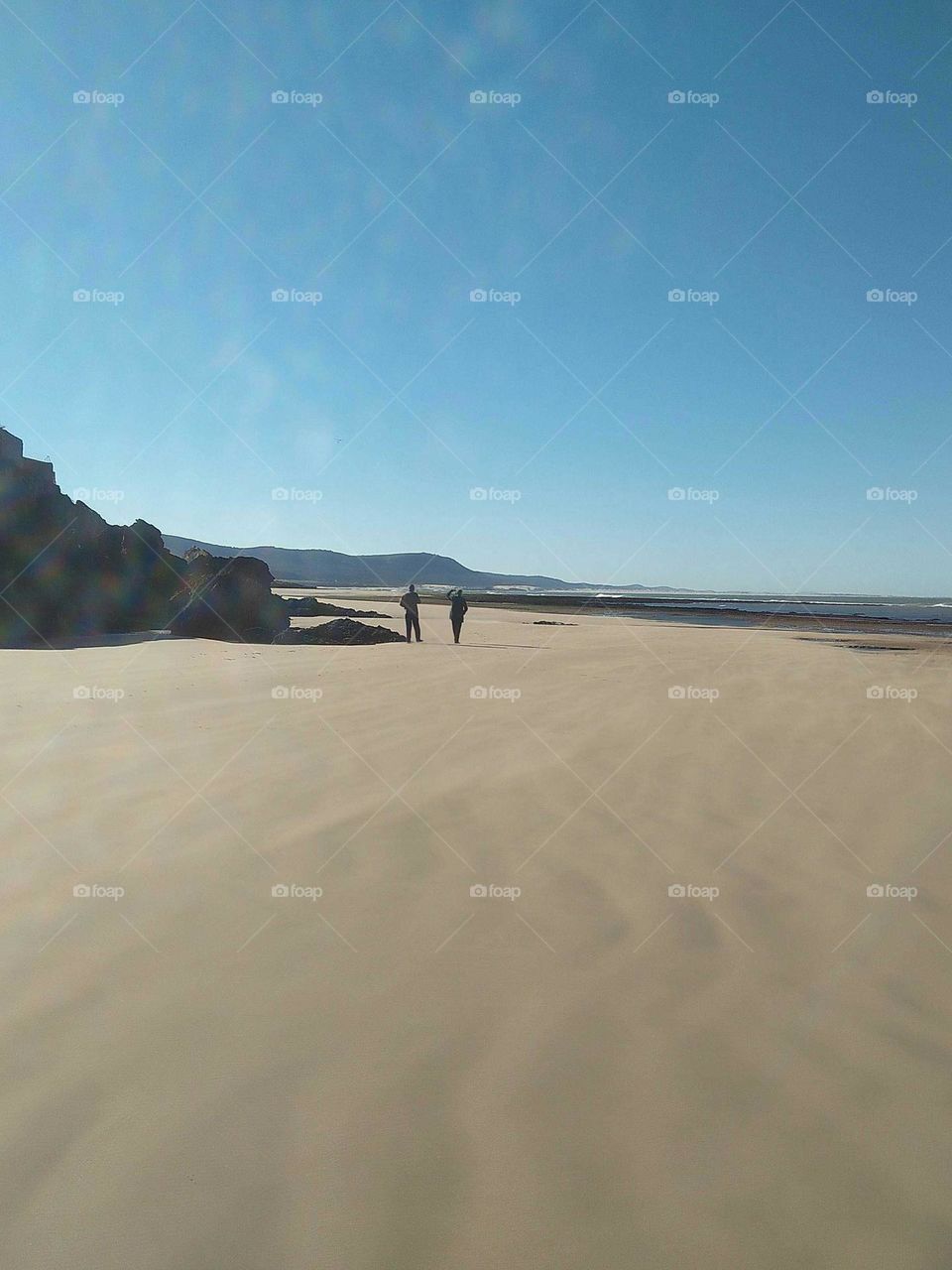 Two people in beach.