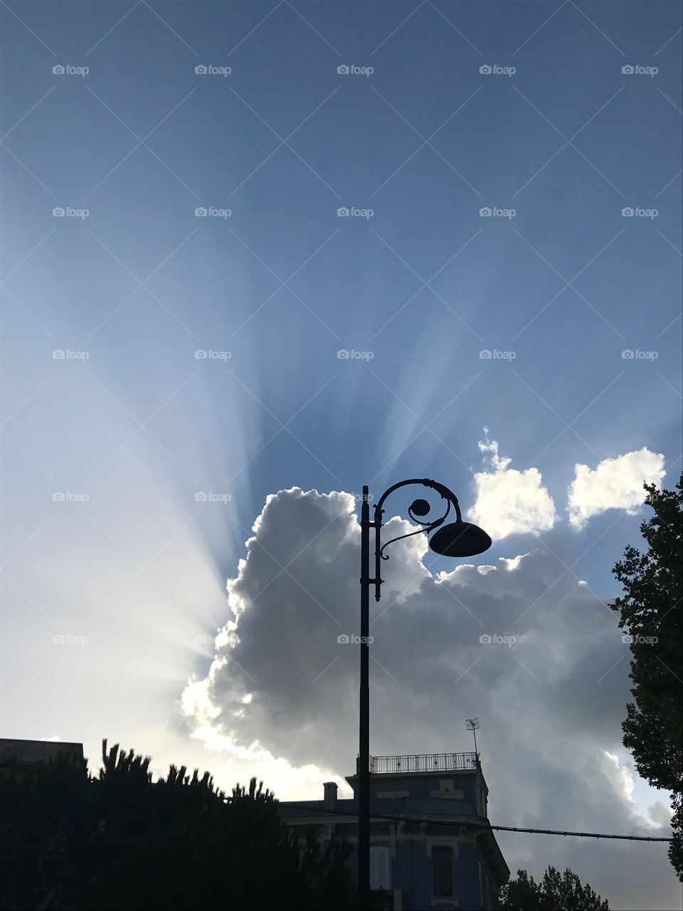 Sun behind the cloud