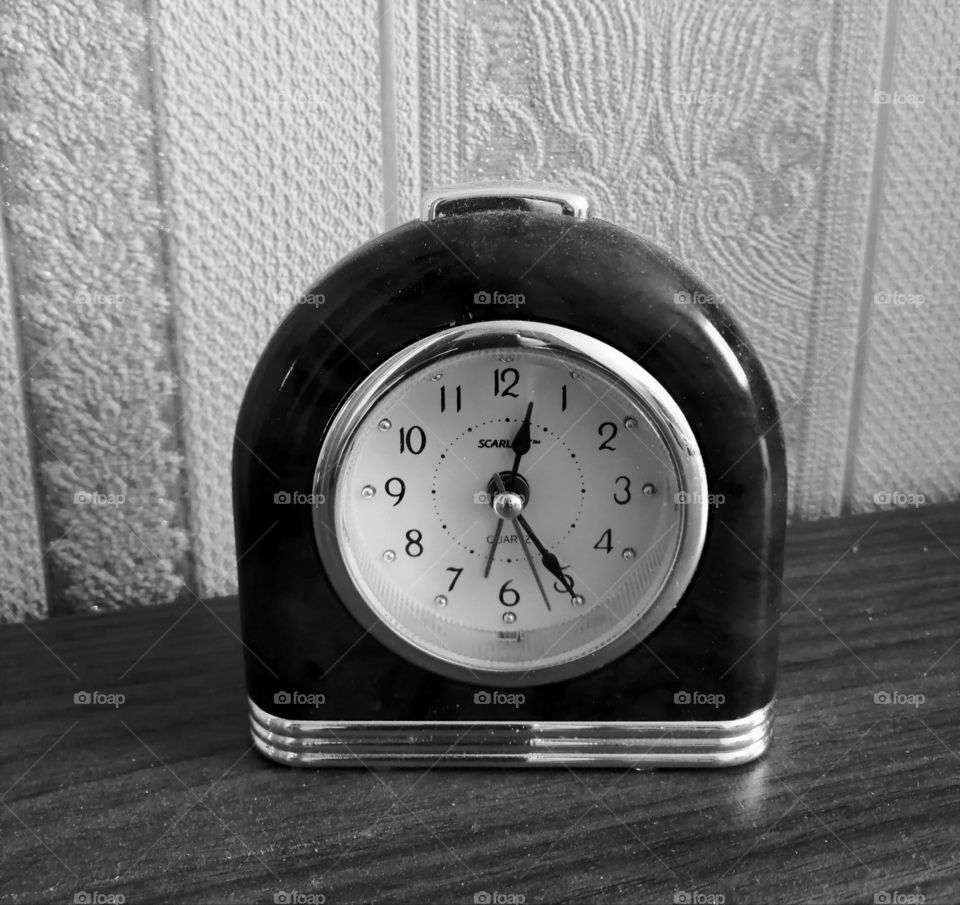 And time passes, photograph of the desktop clock