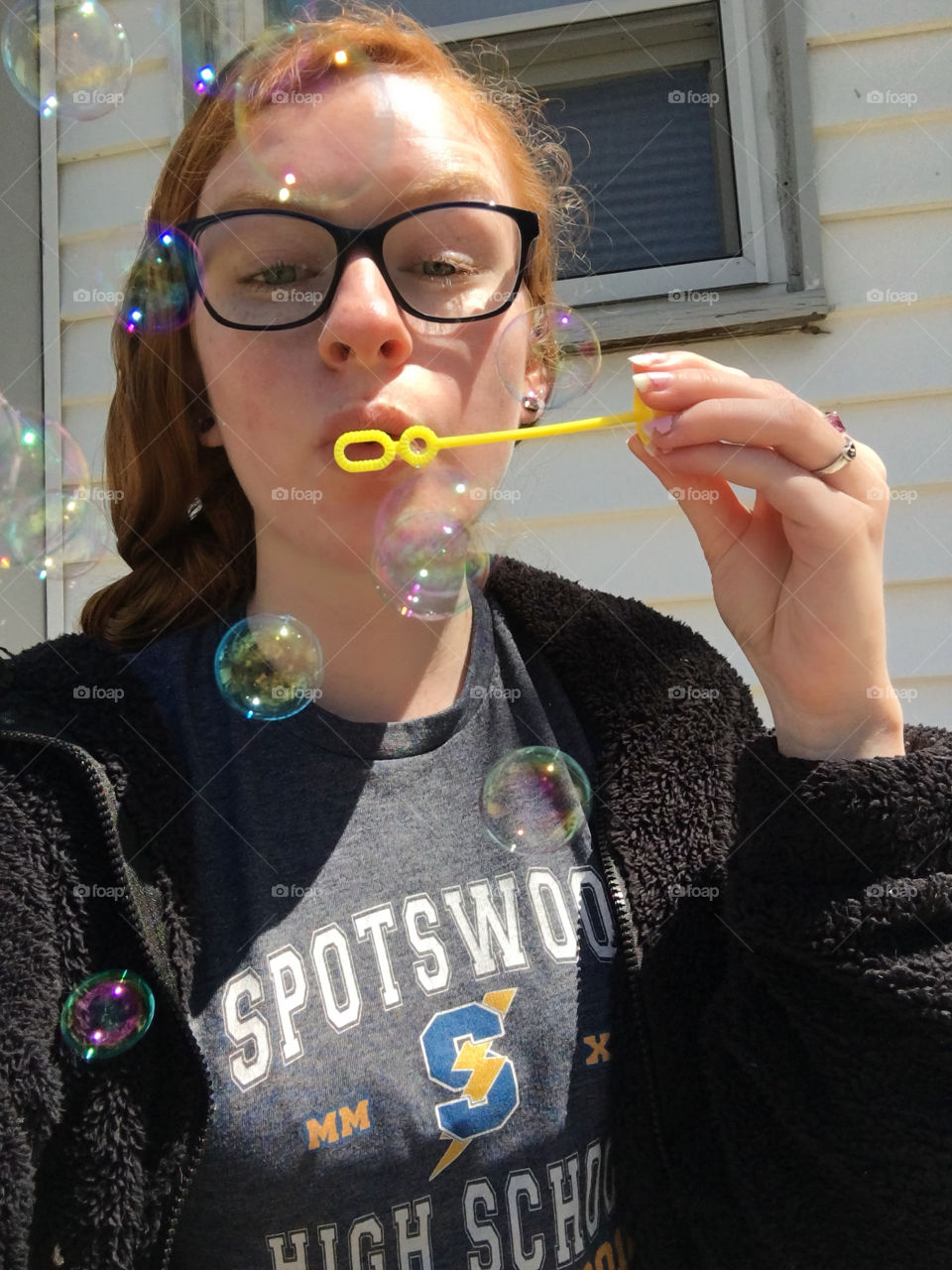 girl blowing bubbles
red hair, blue eyes, glasses, wick