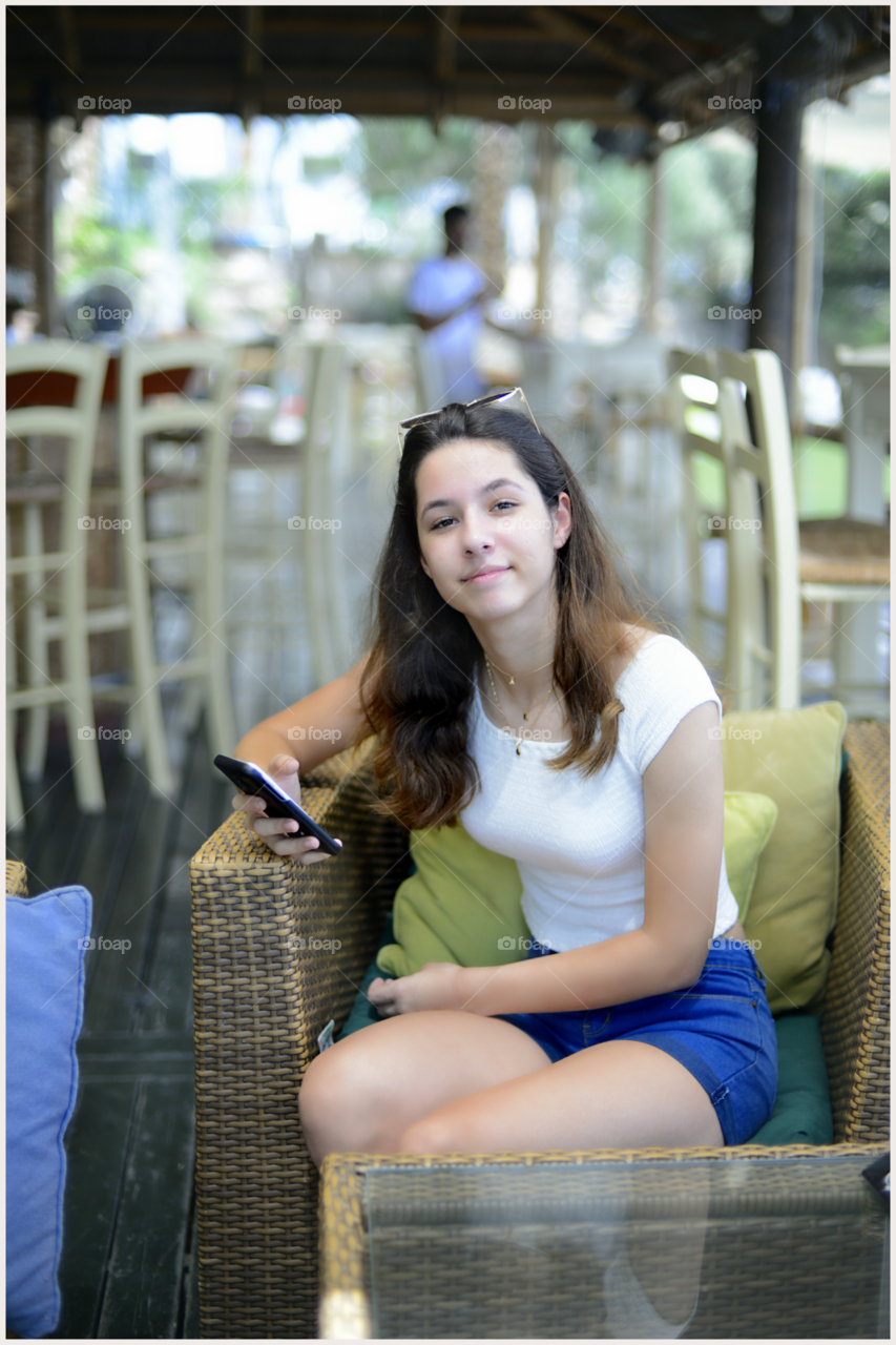 Portrait of a woman holding cellphone