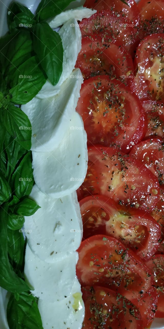 The Caprese salad, besides being very tasty, has the three colors of the Italian flag.  In fact, the name "Caprese salad" means "Capri salad" near Naples.  The ingredients are: "RED tomato", "WHITE mozzarella" and "GREEN basil".