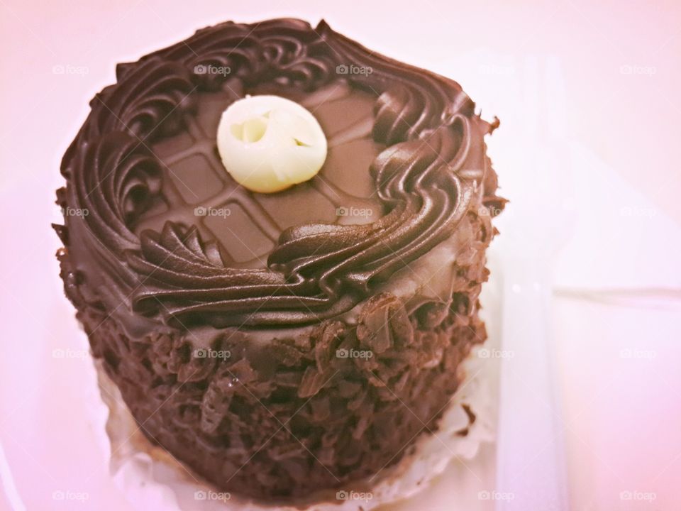 sinful indulgence. rich chocolate cake on lovely evening in Jakarta