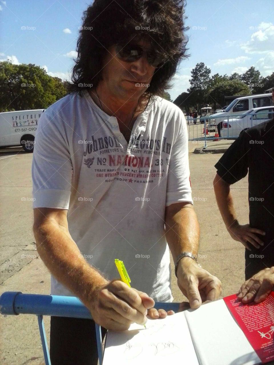 KISS guitarist Tommy Thayer sighning autographs backstage in Dallas,Tx.