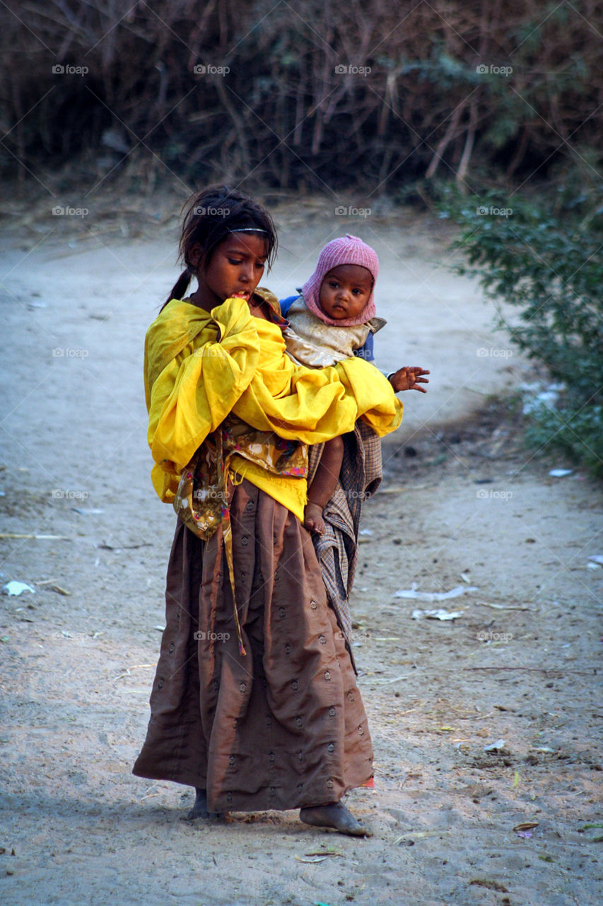 Local peasant girl with baby
