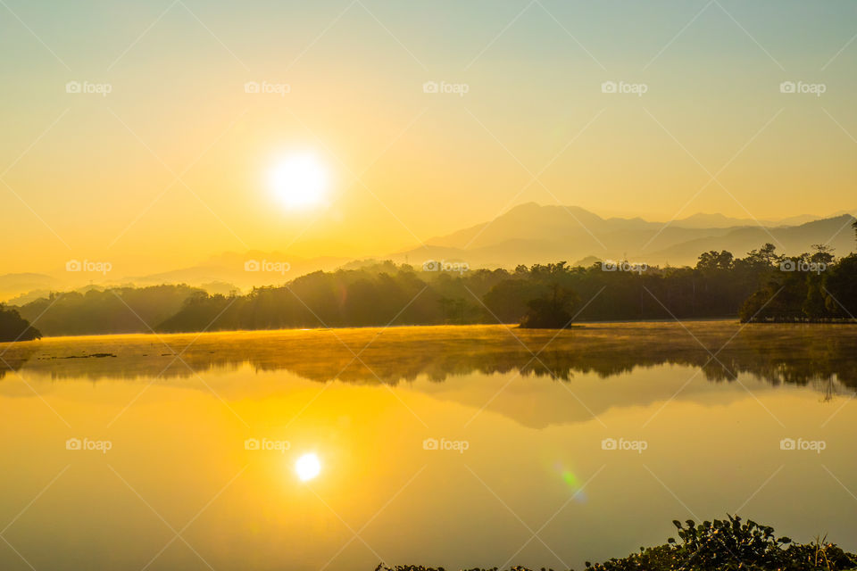 Mountain and sunlight reflection in the lake