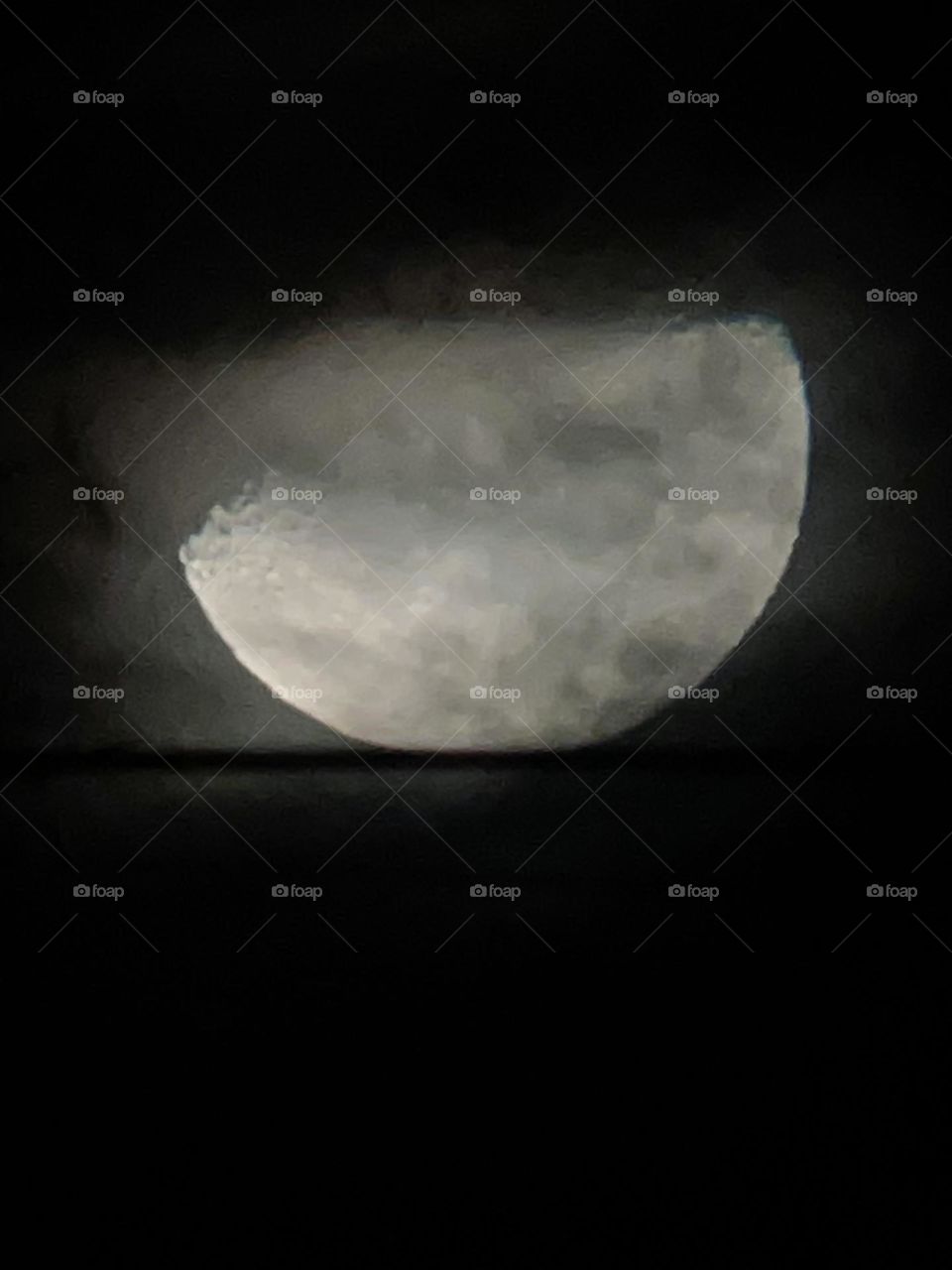 Clouds passing the Moon