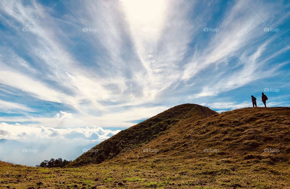 Two men on top of the hill