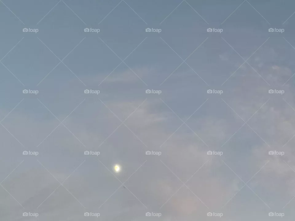 The moon with clouds.