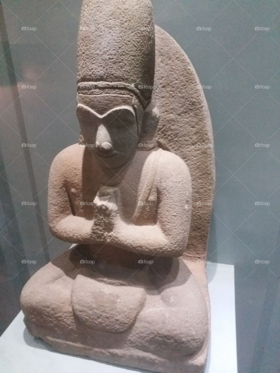 stone statue in prayer