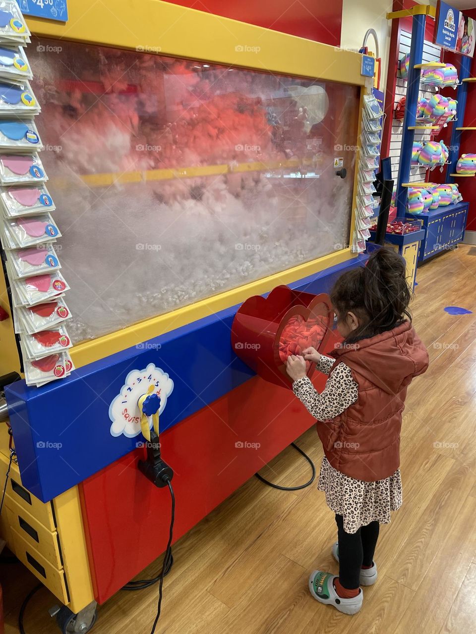 Little girl makes a cat at Build A Bear, making stuffed animals at Build A Bear, toddler girl makes own stuffed animal, picking out a heart for your stuffed animal