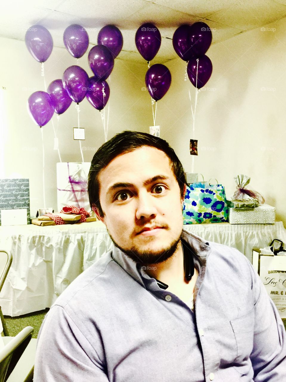 Man and purple balloons