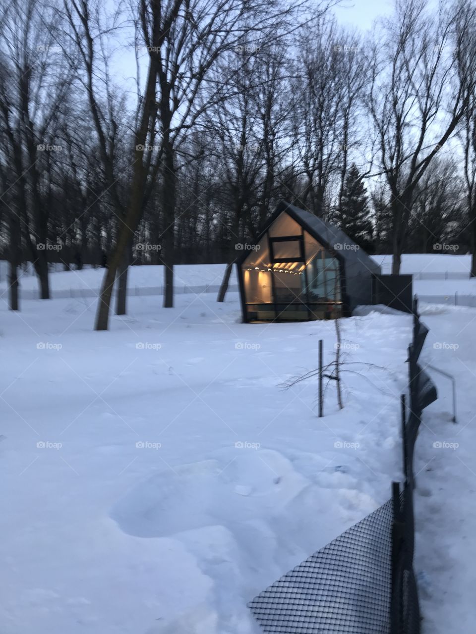 Winter evening with a cute modern tiny house