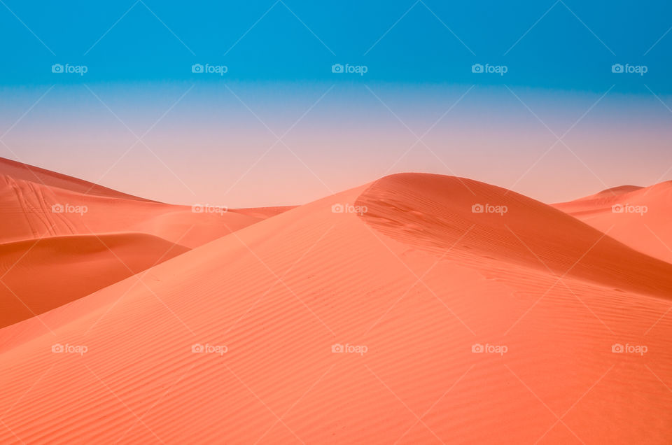 Surreal view of desert dunes in Dubai, UAE.