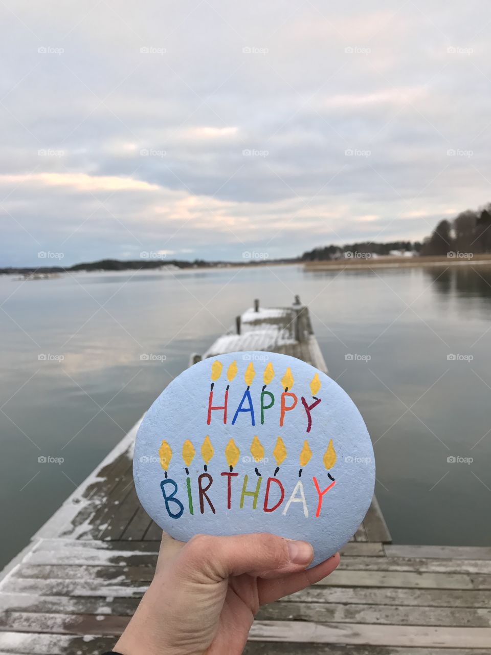 Happy Birthday stone in a hand