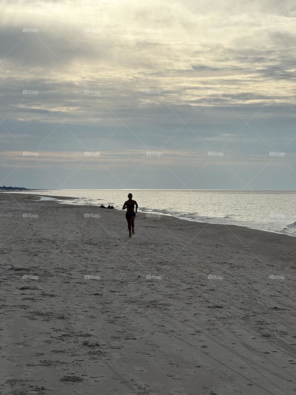 Woman running on the beach 