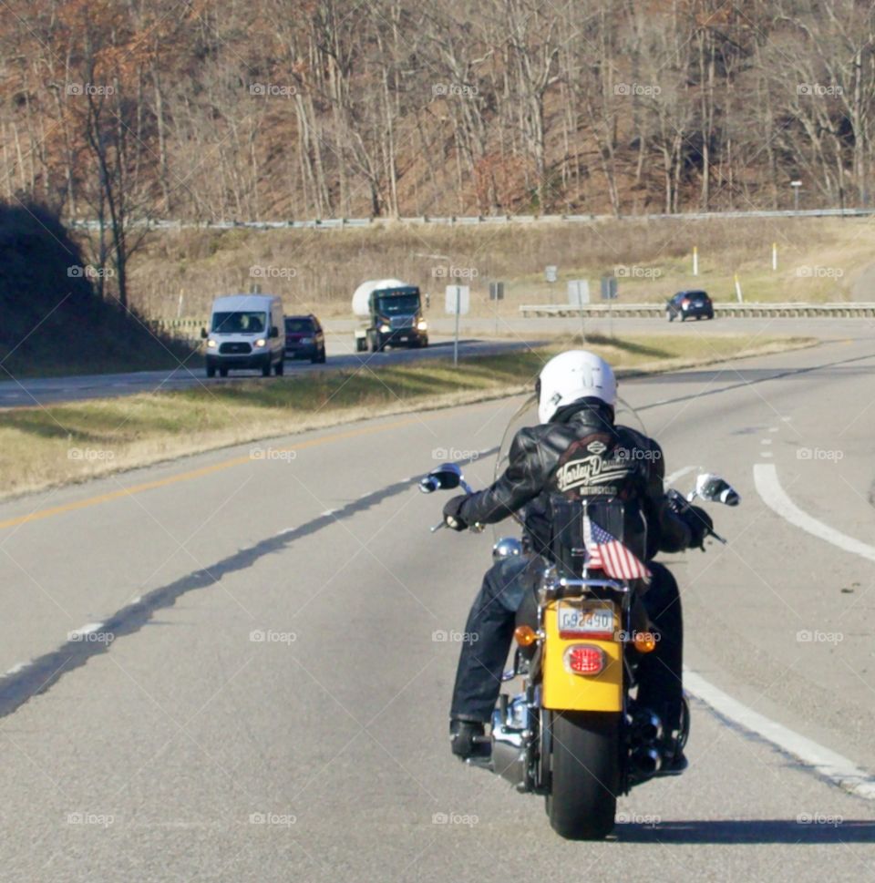 Motorcycle with an American flag on its seat