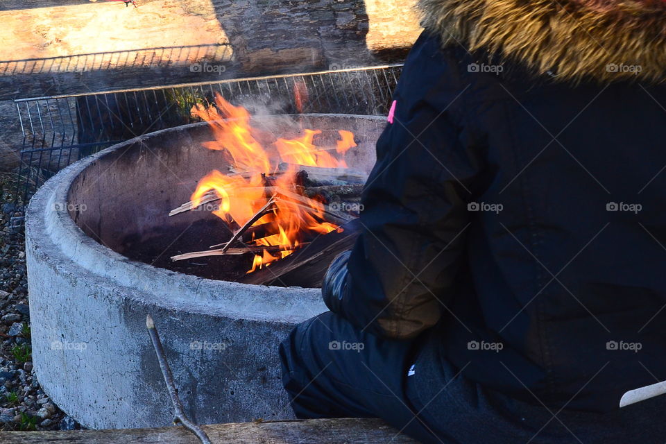 Warming up at the fire