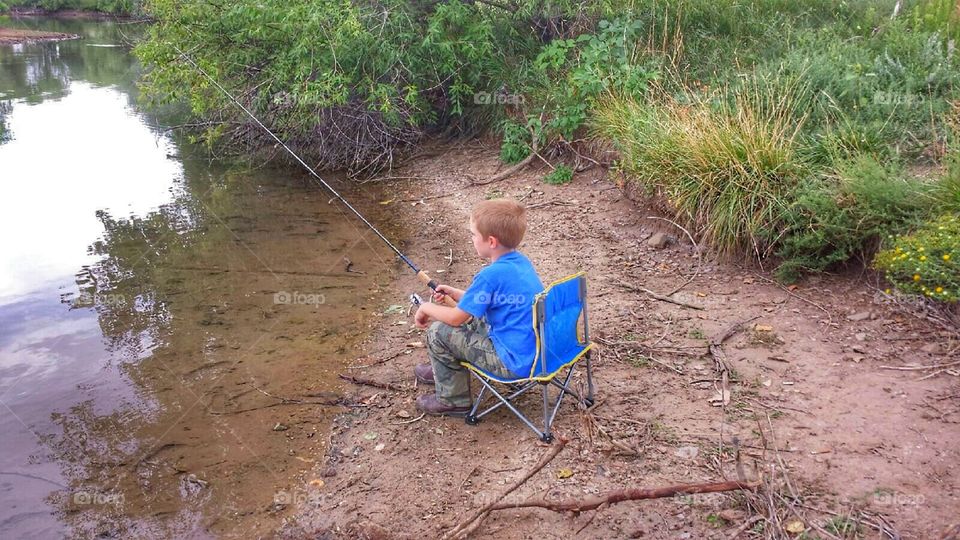 Fishin' Hole. Grandson fishing