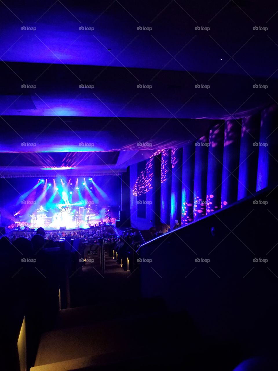 Concert lights reflected onto the wall