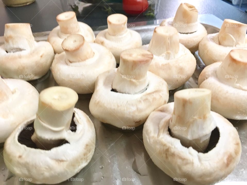 Mushrooms closeup many on pan indoors