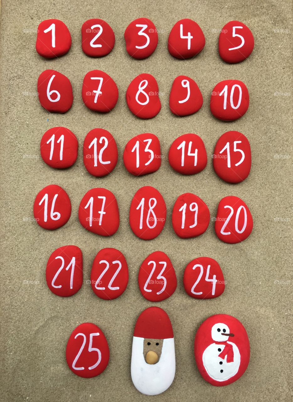 Advent calendar, red colored stones composition 