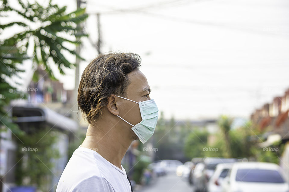 Asean man wear a mask to prevent dust in Bangkok ,Thailand