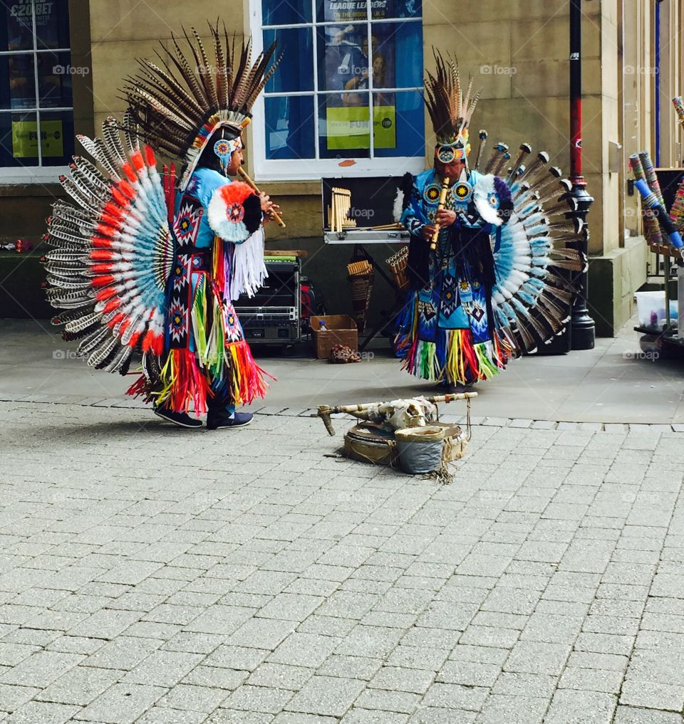 Red Indian people playing flute