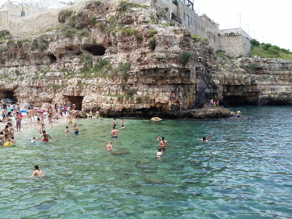 early summer swimming in South Italy. Polignano a mare Apulia, Italy.