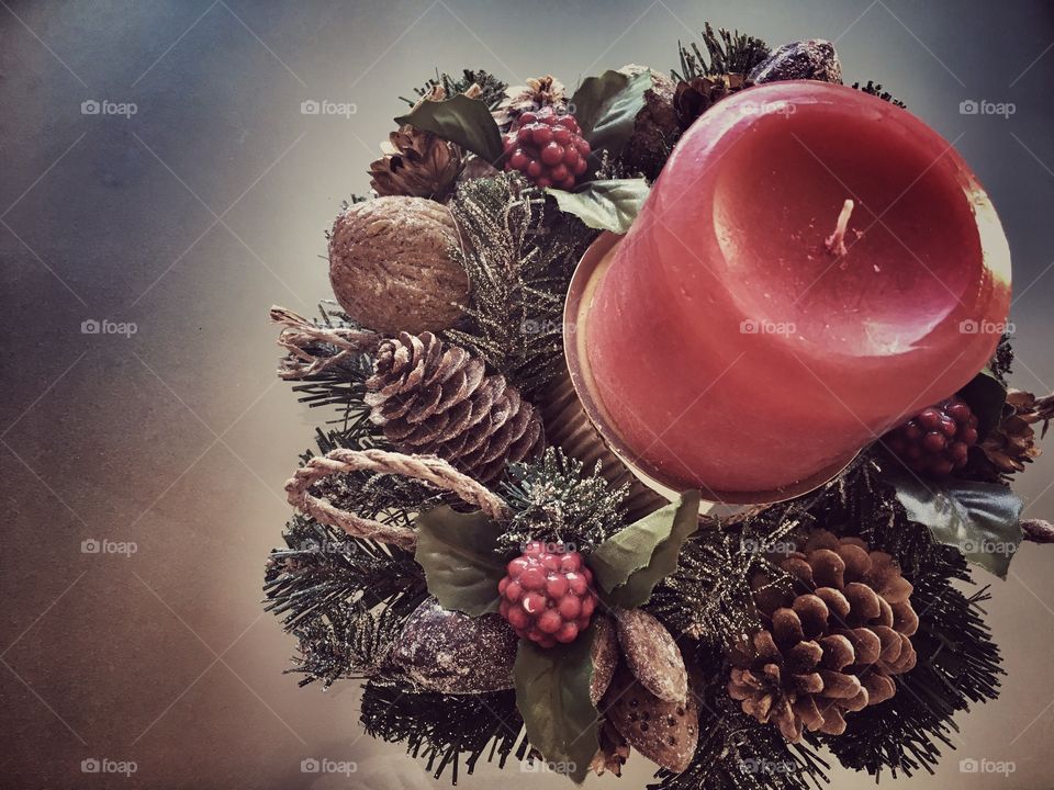 Red candle with wreath